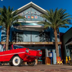 An Amphicar posed in front of the Boathouse Orlando